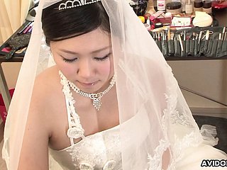 Cloudy Emi Koizumi fucked on wedding apparel uncensored.